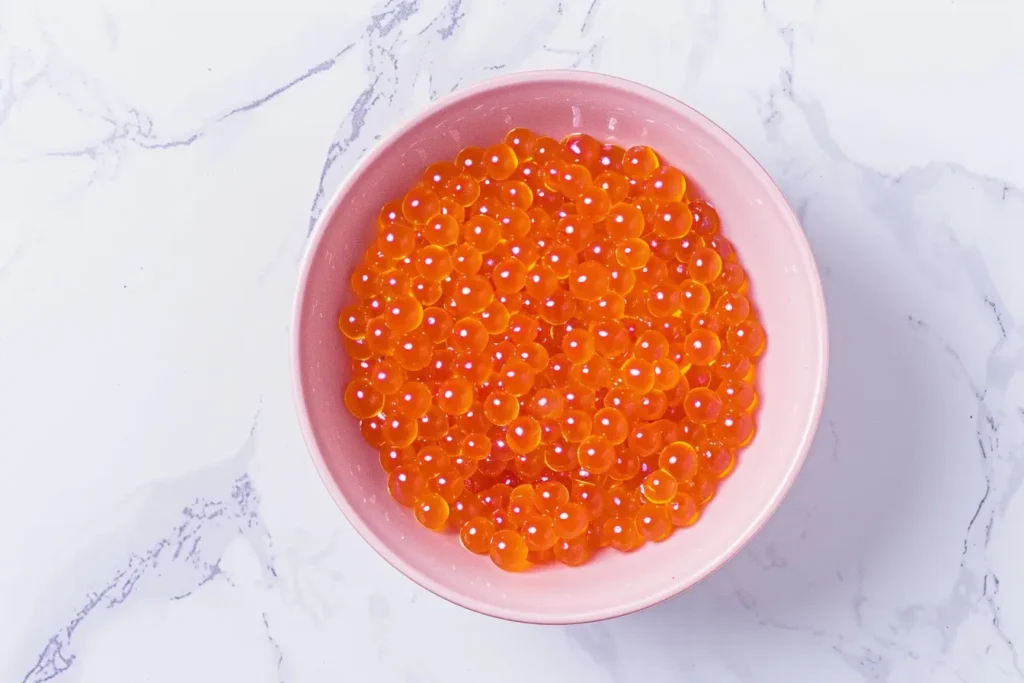 Salmon Roe - Fresh salmon roe in a jar with a spoonful on the side